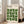 May include: Framed Bauhaus-inspired poster with cream background and geometric green leaf pattern in a 4x4 grid. Black text reads "BAUHAUS Modernism, minimalism & abstract arts 1919-1933" and "SCHOOL OF ARCHITECTURE WEIMAR, DESSAU, BERLIN." Light wood frame leans against white wall next to beige upholstered chair in bright, minimalist living room with large windows and hardwood floors.