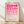 May include: A framed geometric art print featuring pink semicircles and circles arranged in a grid pattern, displayed in a light wood frame against a white wall on wooden flooring with soft natural lighting creating shadows across the scene.