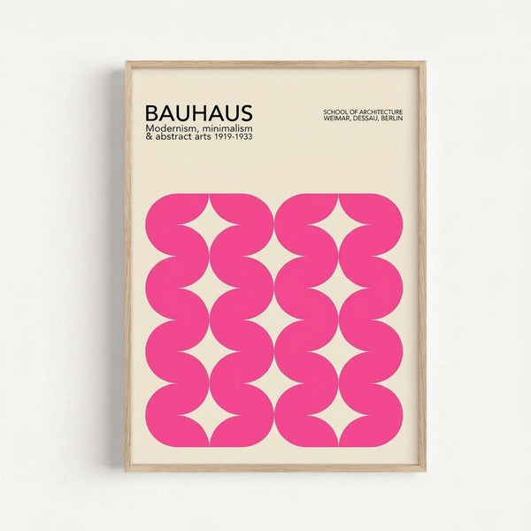 Framed poster with cream background featuring bold pink wavy geometric pattern arranged in a grid formation, creating diamond-shaped negative spaces. Black text at top reads "BAUHAUS" with smaller text about modernism, minimalism and abstract arts 1919-1933, plus "SCHOOL OF ARCHITECTURE WEIMAR, DESSAU, BERLIN". Light wood frame against white wall background.