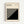 May include: Framed Bauhaus poster with geometric black and cream design featuring diagonal stripes forming an angular pattern. Modern minimalist artwork in light wood frame hanging on white wall. Clean typography at top references the design school's history and locations.