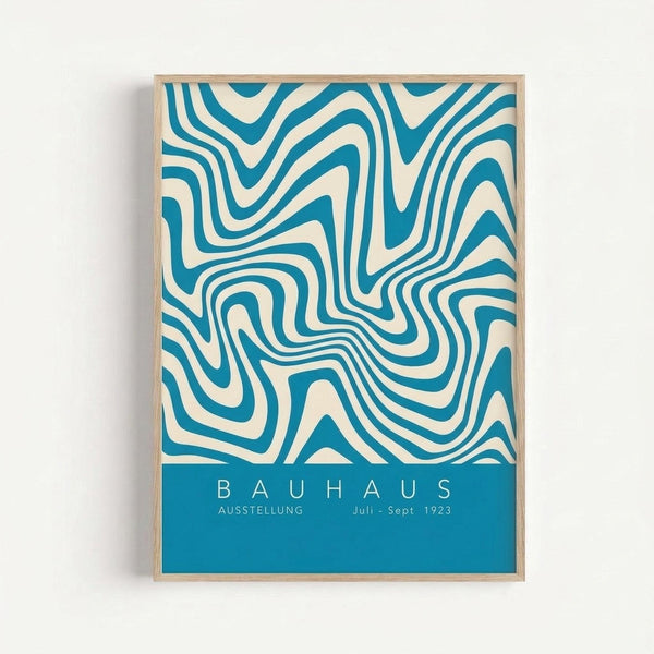 May include: Framed poster with flowing teal and cream wavy lines creating an optical illusion pattern against white wall. Bottom section features solid teal band with white text reading "BAUHAUS AUSSTELLUNG Juli - Sept 1923". Light wood frame surrounds the artwork in minimalist setting.