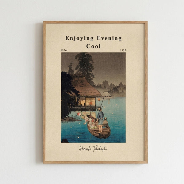 May include: Framed Japanese woodblock print reproduction showing evening lake scene with people in small boat near traditional house with glowing windows, surrounded by trees and mountains. Blue water reflects fireflies or lanterns as small golden dots. Print has cream-colored mat with black text reading "Enjoying Evening Cool" and dates "1926-1927" plus artist signature. Natural wood frame hangs on plain white wall.