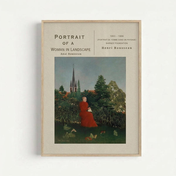 Framed reproduction of Henri Rousseau's naive-style painting showing a woman in a red dress sitting in a lush green landscape with dense foliage, trees, and a church spire in the background. The artwork is displayed in a light wood frame with cream matting against a white wall. The print includes exhibition text above the image mentioning "Portrait of a Woman in Landscape" and Barnes Foundation details from 1993-1996.