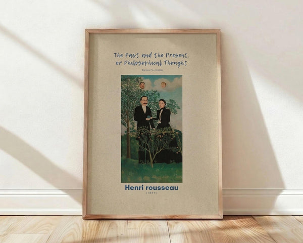 May include: A framed poster print leaning against a white wall on light wood flooring. The artwork shows two men in dark formal wear standing in a lush green landscape with trees and foliage. Two faces appear in the cloudy sky above them. The image has a naive, folk art style with vibrant greens and blues. Text above reads "The Past and the Present, or Philosophical Thought" with "Henri rousseau (1899)" below. The poster has a cream-colored mat and natural wood frame.