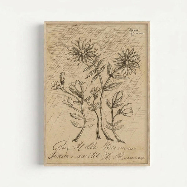 A botanical illustration engraved on light wood showing three flowering plants with detailed stems, leaves, and blooms. The artwork features cross-hatched shading in the background and includes handwritten script text at the bottom. The natural wood grain is visible throughout the piece, which is displayed in a simple wooden frame against a white background.
