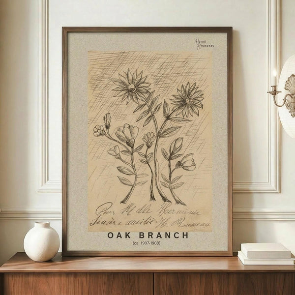 May include: Framed botanical illustration print displayed on wooden credenza in elegant room with cream walls and decorative molding. The vintage-style artwork features hand-drawn flowers and plants in sepia tones on aged paper background with cursive text below. White ceramic vase and books sit nearby. Ornate wall sconce visible on right side.