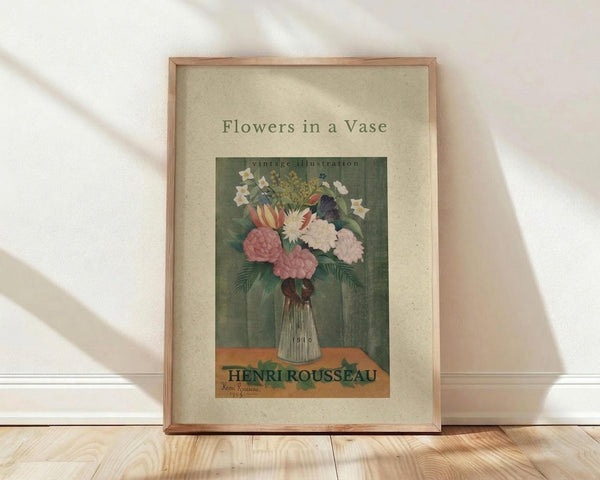 May include: Framed vintage botanical poster showing colorful flowers in a glass vase against green background, displayed on light wooden floor against white wall with natural lighting and shadows. The artwork features pink peonies, white daisies, and foliage in muted tones with cream matting and natural wood frame.