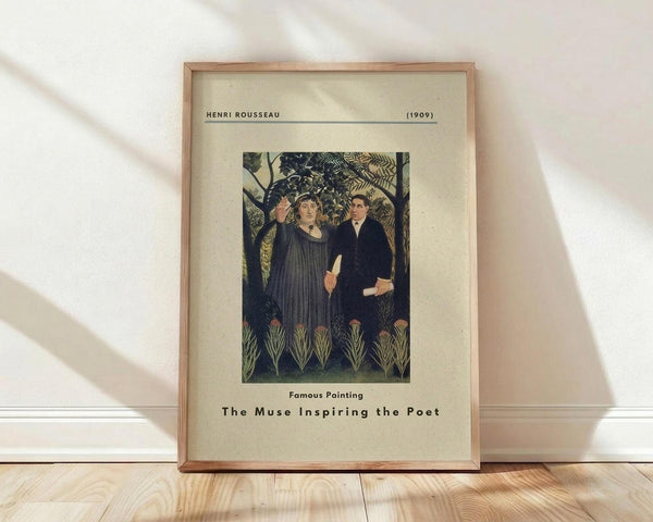 May include: Framed vintage art print reproduction featuring two figures in dark clothing standing among lush tropical foliage with palm fronds and jungle plants. The image shows earthy greens and muted tones in a naive art style. Displayed in light wood frame with cream matting, leaning against white wall on natural wood floors with soft window light creating shadows.