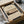 a framed print of Mount Fuji, a famous landmark in Japan, placed in a cardboard box.