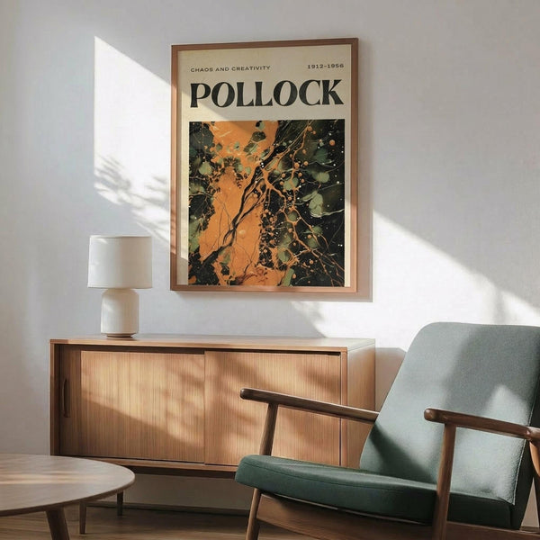 May include: Framed abstract art poster with orange and dark green paint splatters mounted above a mid-century modern wooden credenza. Scene shows mint green upholstered armchair with wooden frame, small round coffee table, and white ceramic table lamp. Warm natural light creates geometric shadows on white wall in minimalist living room setting.
