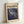 May include: Framed art print leaning against white wall showing abstract expressionist artwork with swirling blues, purples, and cosmic imagery. Text reads "CHAOS AND CREATIVITY" and "POLLOCK 1912-1956" above the vibrant space-like composition featuring flowing paint effects, circular forms, and stellar elements in deep blue and purple tones with gold accents.