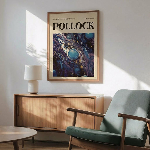 May include: Framed poster featuring Jackson Pollock's abstract expressionist artwork with swirling blue, purple, and white paint drips in cosmic patterns. Displayed above mid-century modern wooden credenza with white ceramic lamp, next to sage green upholstered armchair with wooden frame. Warm natural lighting creates shadows on white wall in contemporary living room setting.