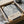 A framed print titled "A Journey Through Chaos" by Jackson Pollock, which is a painting by the renowned American artist. The print is displayed in a cardboard box, and the text on the box indicates that it is a new arrival.