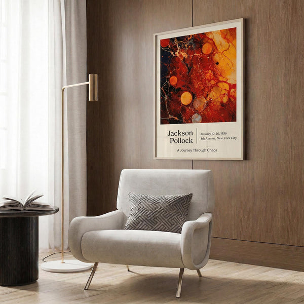 a modern living room with a white armchair, a floor lamp, and a framed abstract art print hanging on the wall.
