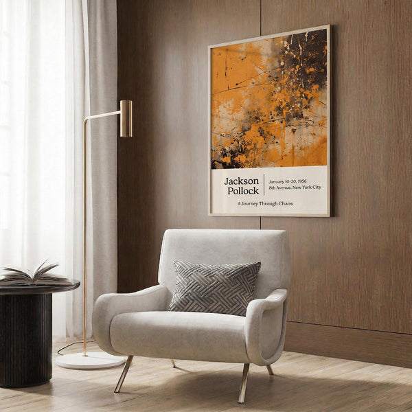a modern living room with a white armchair, a floor lamp, and a framed poster on the wall.