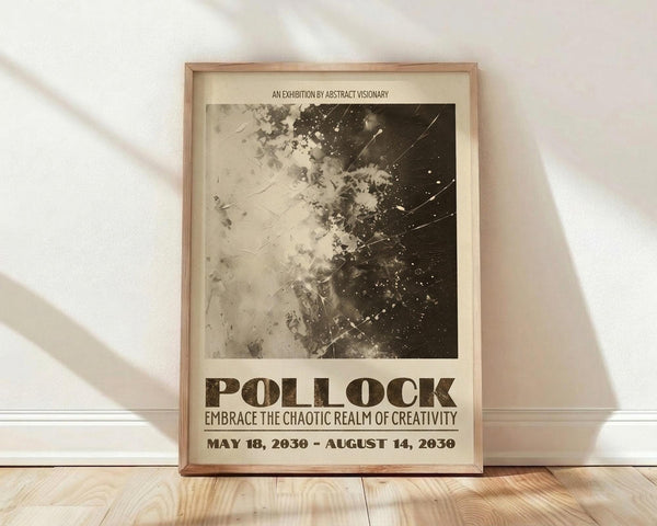May include: Framed exhibition poster with abstract black and white splattered artwork in Jackson Pollock style, featuring dramatic paint splatters and drips transitioning from light to dark. Poster displays "POLLOCK" in large brown letters with exhibition text and dates. Natural wood frame leans against white wall on light wooden floor with soft natural lighting creating diagonal shadows.