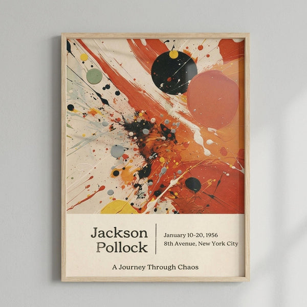 A framed abstract art poster featuring dynamic paint splatters and brushstrokes in orange, red, black, yellow, and green against a cream background. The energetic composition includes circular shapes and diagonal streaks radiating from a central burst of color. Below the artwork, text reads "Jackson Pollock" with exhibition details "January 10-20, 1956, 8th Avenue, New York City" and "A Journey Through Chaos." The poster is displayed in a light wood frame against a white wall.
