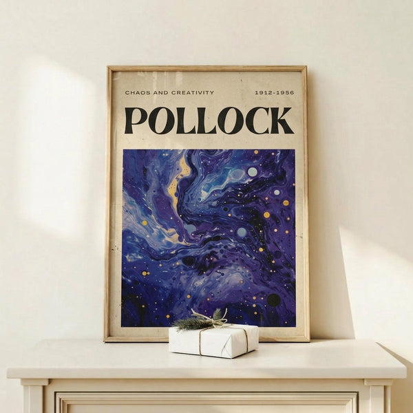 May include: Framed art print featuring swirling cosmic blues and purples with golden accents, displayed on light wood console table next to small wrapped gift with twine bow. Poster shows abstract fluid patterns resembling galaxies or nebulae in deep indigo, violet and cream tones with scattered circular elements. Natural wood frame complements minimal neutral room setting.