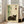 May include: Framed poster with cream background featuring a sleeping brown tabby cat, green bamboo stalks, and black Japanese characters with red accent. Light wood frame leaning against white wall next to beige upholstered chair in bright, airy room with large windows and hardwood floors.