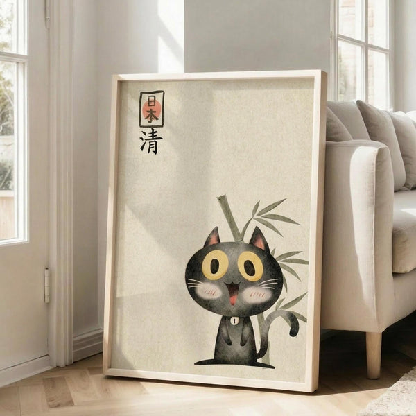 May include: Framed poster print featuring a cute black cat with large yellow eyes and rosy cheeks sitting beside green bamboo stalks, with Japanese characters at top, displayed on light wooden floors next to a beige upholstered chair in a bright room with white walls and windows