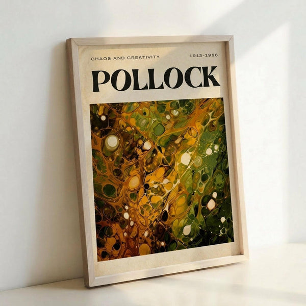 May include: Framed poster print featuring Jackson Pollock's abstract expressionist artwork with swirling patterns of green, yellow, orange and white paint in his signature drip style. The print has "POLLOCK" in bold black letters at top with "CHAOS AND CREATIVITY 1912-1956" subtitle. Natural wood frame leaning against white wall corner on light surface, showing warm lighting and shadows.