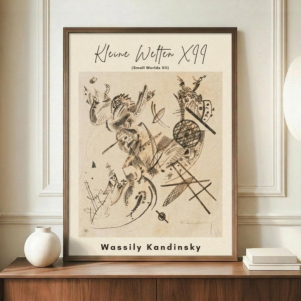 May include: Abstract modernist artwork print in warm brown frame, displayed on wooden sideboard against cream paneled wall. Features dynamic abstract forms with cross-hatching, geometric patterns, and flowing lines in sepia tones on aged paper background. White ceramic vase and stacked books create styled vignette beside the framed print.