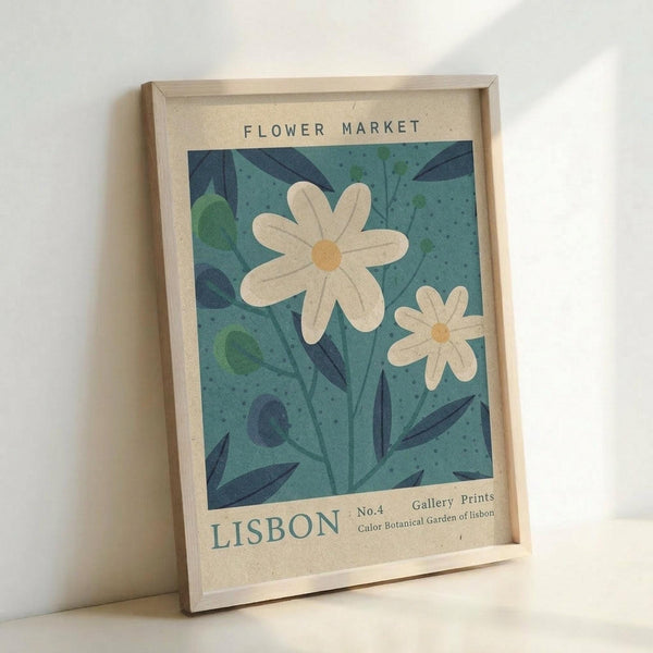 May include: Framed botanical poster print leaning against white wall, featuring two white daisies with yellow centers on teal blue background with dark green leaves and stems, vintage-style design with "FLOWER MARKET" and "LISBON" text at top and bottom, displayed in light wood frame on neutral surface