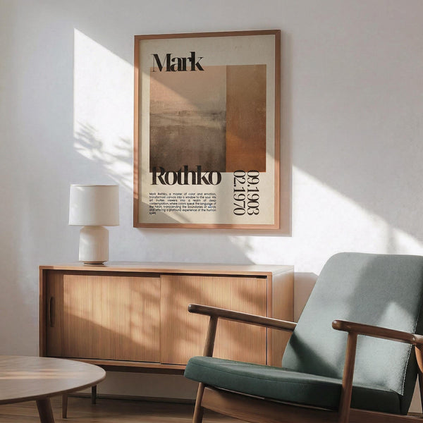 a minimalist living room with a wooden cabinet, a green armchair, and a wooden coffee table. A framed poster with text hangs on the wall above the cabinet.