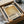 a framed poster or artwork with the name "Rothko" printed on it, placed in a cardboard box.