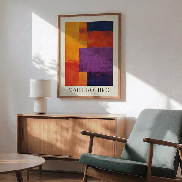 a modern living room with a wooden cabinet, a green armchair, and a wooden coffee table. Above the cabinet, there is a framed abstract painting with a vibrant mix of orange, purple, and yellow colors.