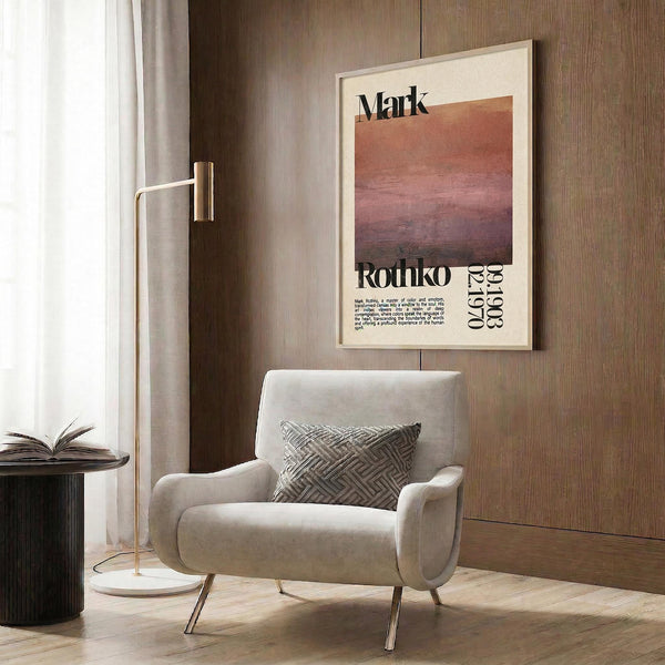 a modern living room with a white armchair, a floor lamp, and a framed poster on the wall.