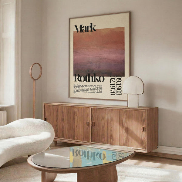a living room with a large wooden cabinet, a white sofa, and a glass coffee table. Above the cabinet, there is a framed poster with text and an abstract design.