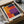 A framed abstract painting titled "Mark Rothko" is displayed in a cardboard box, which is wrapped in plastic.