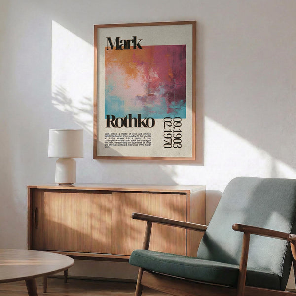 a living room with a framed poster of an abstract painting hanging on the wall, a wooden cabinet, a green armchair, and a round wooden table.