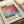 The image is a framed poster featuring an abstract painting with a color palette of orange, pink, and blue. The text on the poster provides information about the artist, Mark Rothko, and his work.