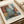 The image is a framed poster featuring an abstract painting with bold geometric shapes and colors.