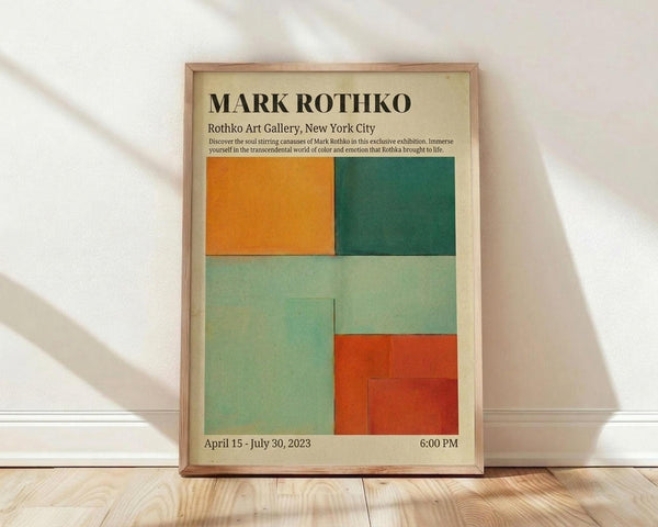 May include: Framed exhibition poster for Mark Rothko leaning against white wall on wooden floor. Features abstract color blocks in orange, dark green, light green, and red-orange arranged in rectangular sections. Cream background with black text showing gallery information and exhibition dates. Natural wood frame with soft lighting casting shadows on wall.