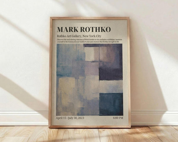 May include: Framed exhibition poster featuring Mark Rothko's abstract color field artwork with soft blues, grays, purples and cream rectangular blocks. Gallery information and exhibition dates displayed in black text on cream background. Natural wood frame leaning against white wall on light wooden floor with soft window light shadows.