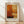 May include: Abstract art poster print with warm orange, rust, and cream colored rectangular blocks in painterly style, displayed in light wood frame with cream matting against white wall on wooden floor with natural window light casting shadows