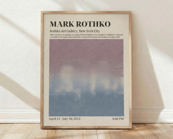 May include: Framed exhibition poster for Mark Rothko at Rothko Art Gallery, New York City, featuring a gradient color field transitioning from mauve purple at top to dusty blue at bottom. Light wood frame with cream matting, leaning against white wall on light wooden floor with natural sunlight shadows. Exhibition dates April 15 - July 30, 2023 at 6:00 PM printed below the artwork.