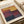 The image is a poster for an art exhibition titled "Mark Rothko" featuring a large abstract painting with bold colors.
