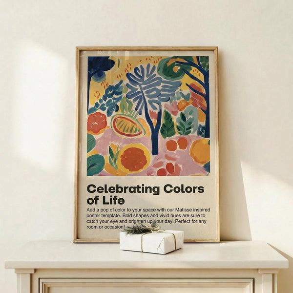 May include: Framed poster with colorful Matisse-style botanical artwork featuring abstract plants, fruits, and leaves in blues, oranges, pinks, and greens, displayed on light wood shelf next to small wrapped gift box with natural twine and greenery sprig against cream wall