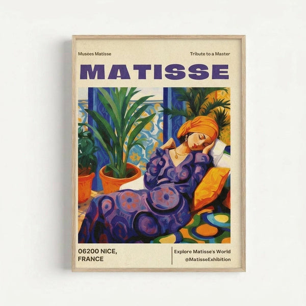 May include: Framed poster print displayed against white wall showing Henri Matisse exhibition artwork. Features woman in purple patterned dress and orange head wrap reclining among potted plants. Vibrant colors include blues, greens, oranges, and purples in Matisse's distinctive style. Text reads "MATISSE," "Musées Matisse," "06200 NICE, FRANCE," and "Tribute to a Master." Light wood frame visible around cream-colored poster.