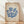 May include: Framed vintage exhibition poster with blue coral-like branching forms on cream background, displayed in light wood frame against white fabric backdrop on wooden floor. Poster features "MATISSE" text at top and "BERGGRUEN & CIE" with French gallery details below the organic blue shapes.
