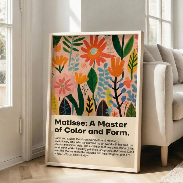May include: Framed art poster with colorful botanical illustration featuring pink, orange, green and blue flowers and leaves on cream background, displayed in bright living room next to beige sofa near large windows with natural lighting on light wood floors