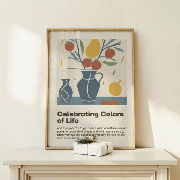 May include: Matisse-inspired poster in light wood frame leaning against white wall on wooden shelf, featuring colorful still life with blue vases, red fruits, yellow lemon, and botanical elements in cut-paper collage style. Small wrapped gift box with greenery sits in front. Warm natural lighting creates soft shadows on cream background.