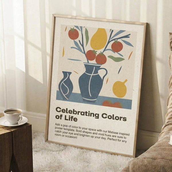 May include: Framed poster with Matisse-inspired still life artwork featuring blue ceramic vases, colorful fruit including yellow lemons and red oranges, green foliage, displayed on cream textured paper. Shows "Celebrating Colors of Life" text below illustration. Frame leans against white wall corner next to wooden side table with white coffee cup, cream knit throw blanket visible, creating cozy home interior mockup scene.