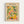 May include: Framed art poster in light wood frame mounted on white wall, featuring colorful still life illustration with citrus fruits, leafy plants, bottles and bowls in Matisse-inspired style using yellow, green, pink and orange tones on cream background with "MATISSE" and "ART POSTER" text