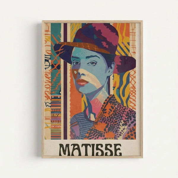 Colorful stylized portrait of a woman wearing a purple and pink hat, rendered in vibrant blues, oranges, yellows and pinks with geometric patterns and abstract elements. The artwork features bold brushstrokes and modern artistic styling reminiscent of Fauvism, with decorative borders containing various patterns and textures. The woman has blue-toned skin, red lips, and is wearing patterned clothing. The word "MATISSE" appears in black letters at the bottom. The print is displayed in a light wood