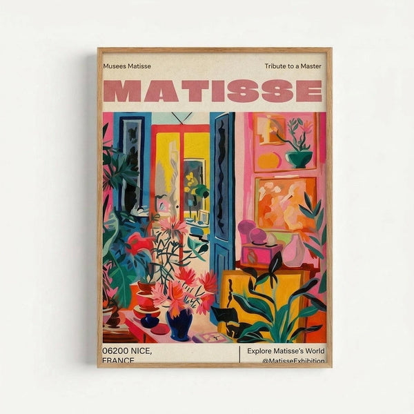 Framed poster featuring a colorful Matisse-style interior scene with vibrant plants, furniture, and artwork in bold reds, blues, yellows and greens. The poster displays "MATISSE" in large red letters at the top, with "Musees Matisse" and "Tribute to a Master" as headers. Bottom text shows "06200 NICE, FRANCE" and "Explore Matisse's World @MatisseExhibition". The artwork depicts an artist's studio with French doors, potted plants, easels, and painting